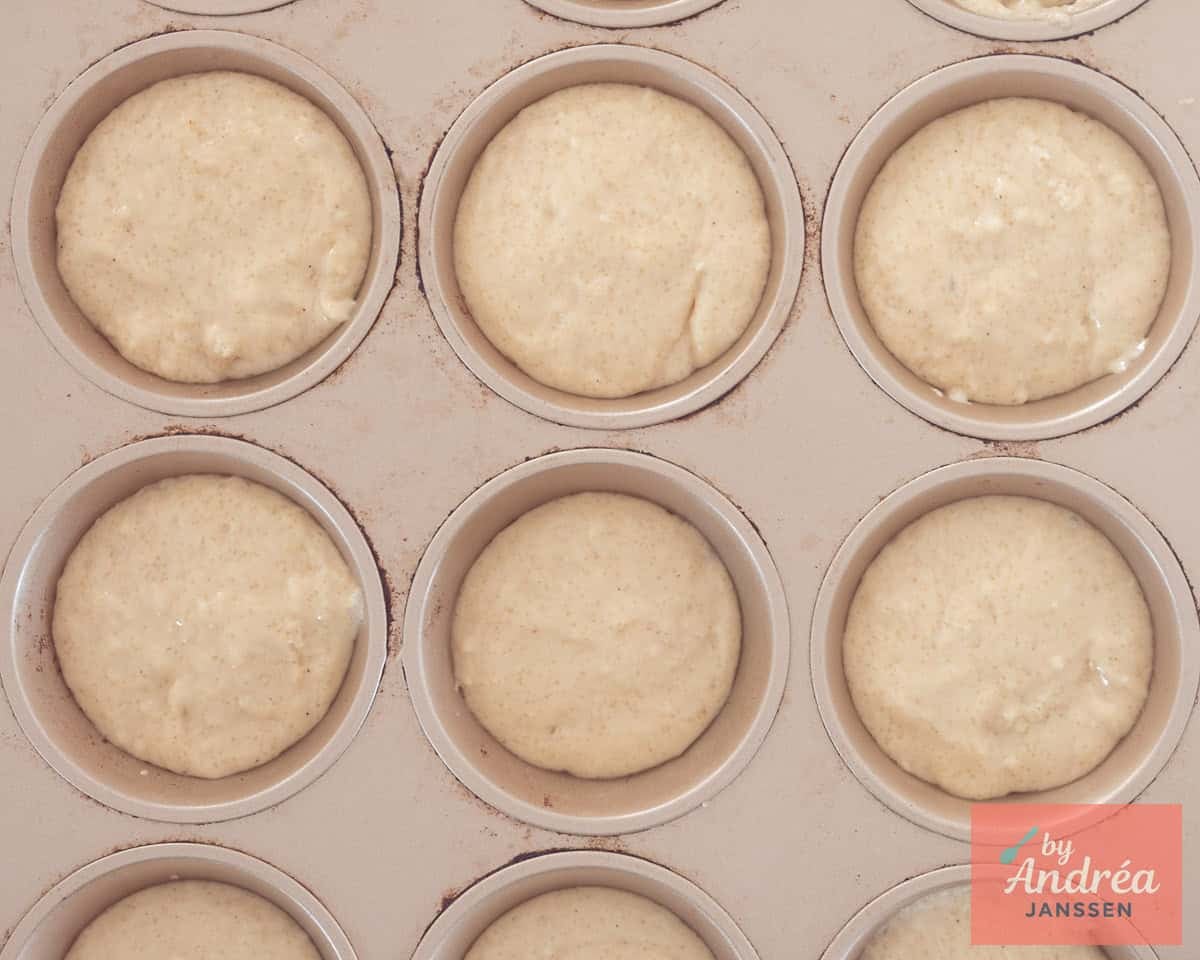 A muffin tin filled with muffin batter
