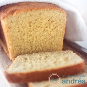 a square photo with cornbread. A white towel on top. Some slices cut off