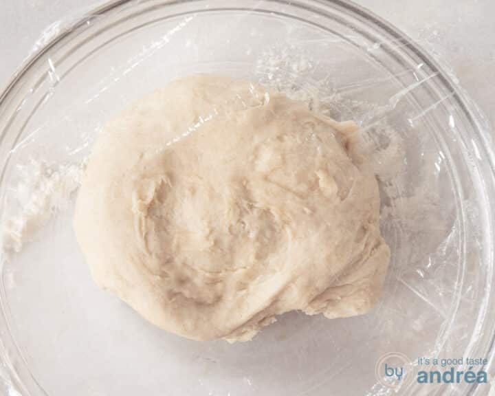 Dough in a glass bowl covered with foil. still needs to rise.
