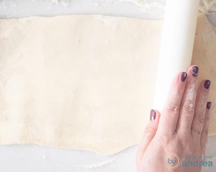 Roll out the dough until thin with a white rolling pin.