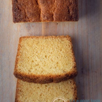 Two slices of Dutch pound cake on a wooden board. Part of the cake on top.