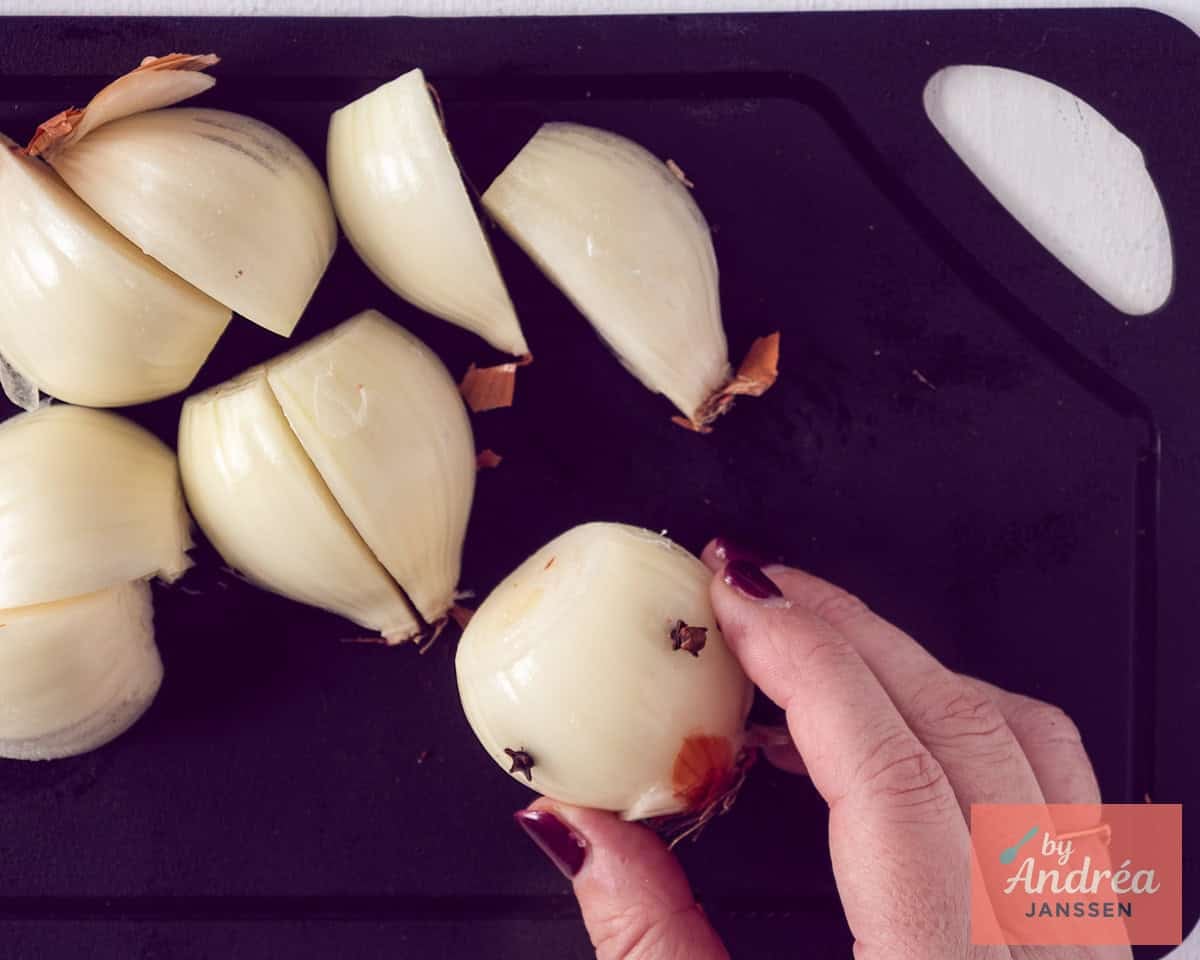 Quarter the onions and pack cloves in them so you can get them easily out