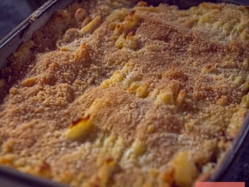 A square photo with a sauerkraut and minced meat casserole with mashed potatoes on top.