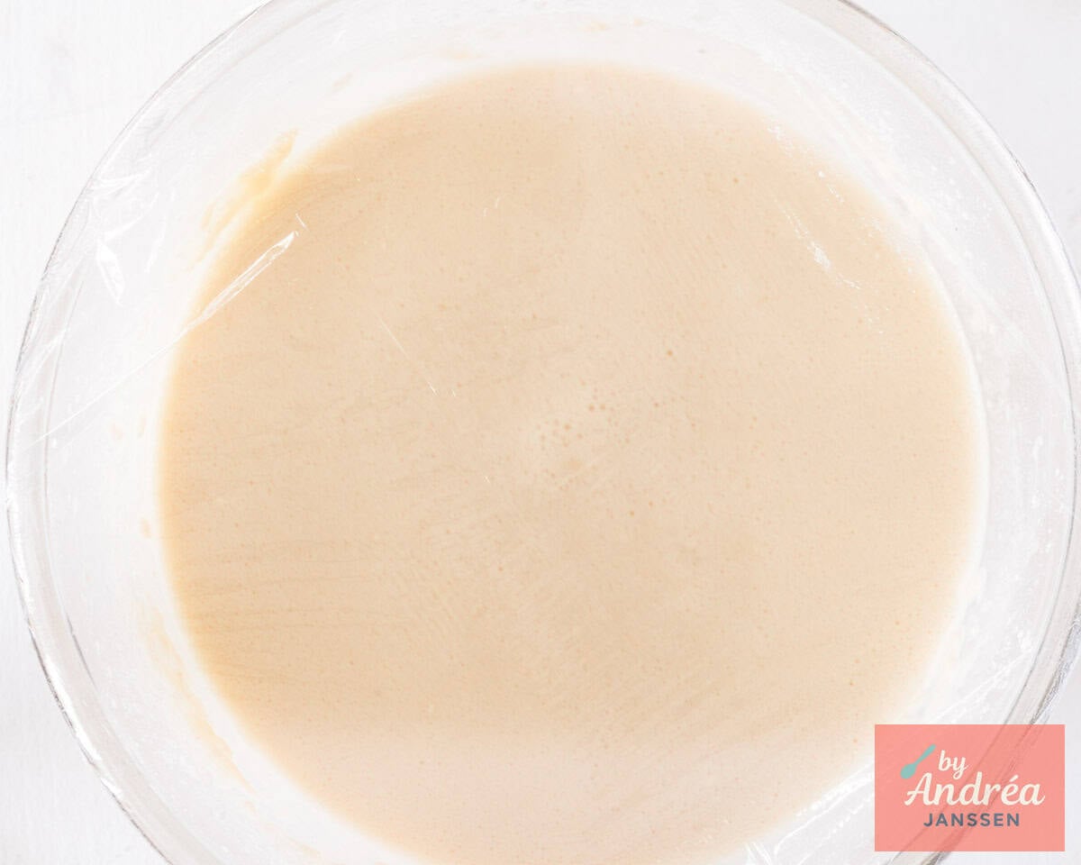 Batter in a glass bowl covered with plastic foil