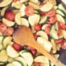 Zucchini, tomatoes stir-fried and seasoned with herbs.