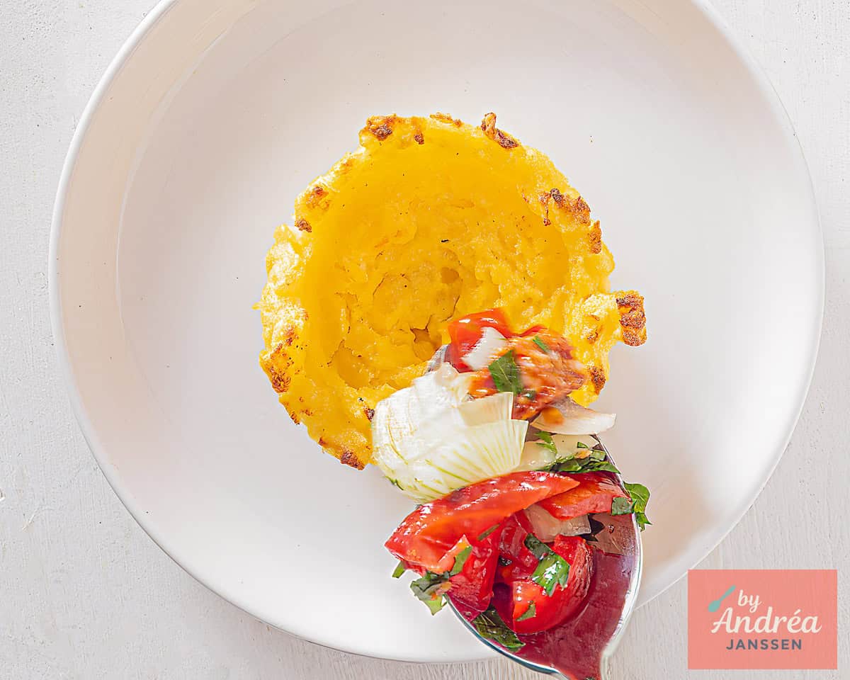 Tomato filling is spooned into a polenta cup