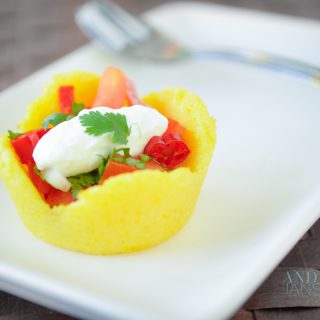 polenta cup with tomato filling on a plate