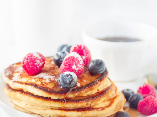 pancakes on a plate with fresh fruit