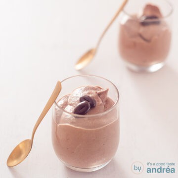 A square photo with two glasses filled with chocolate mousse