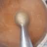 The pumpkin soup is pureed with a hand blender.