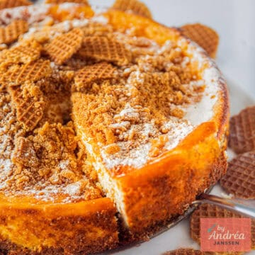 A square photo showing a slice of a stroopwafel cheesecake.