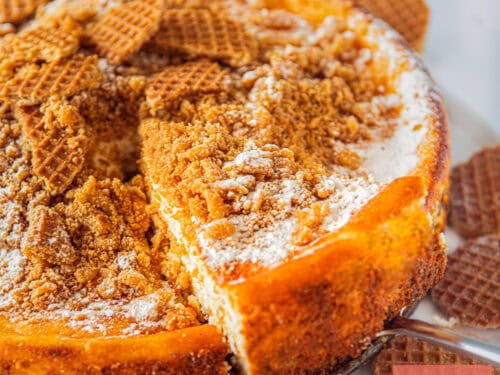 A square photo showing a slice of a stroopwafel cheesecake.