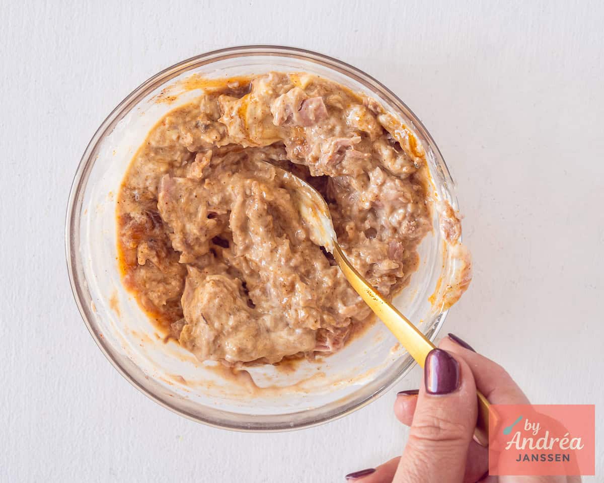 Make tuna salad with mayonnaise, curry sauce, and herbs