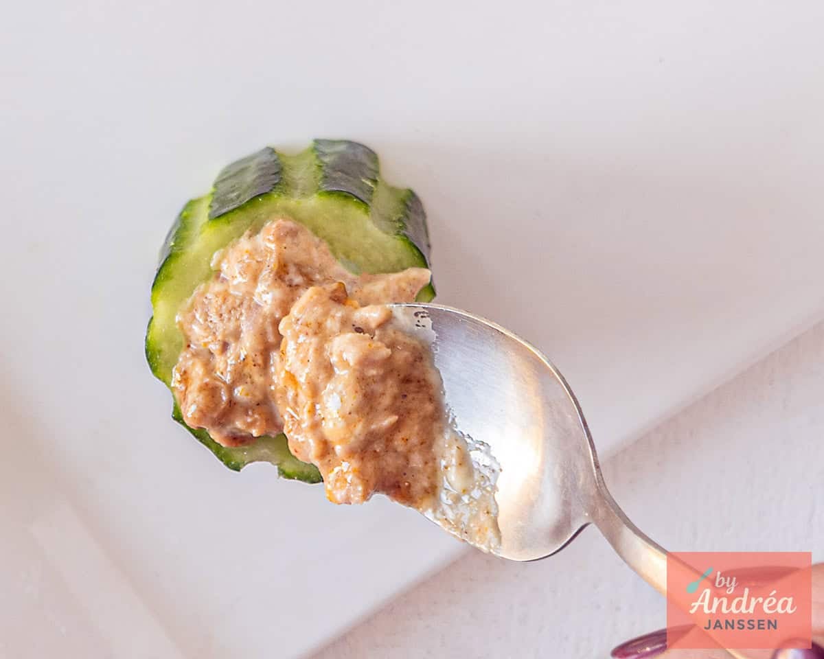 Fill the hollowed-out cucumbers with tuna salad.