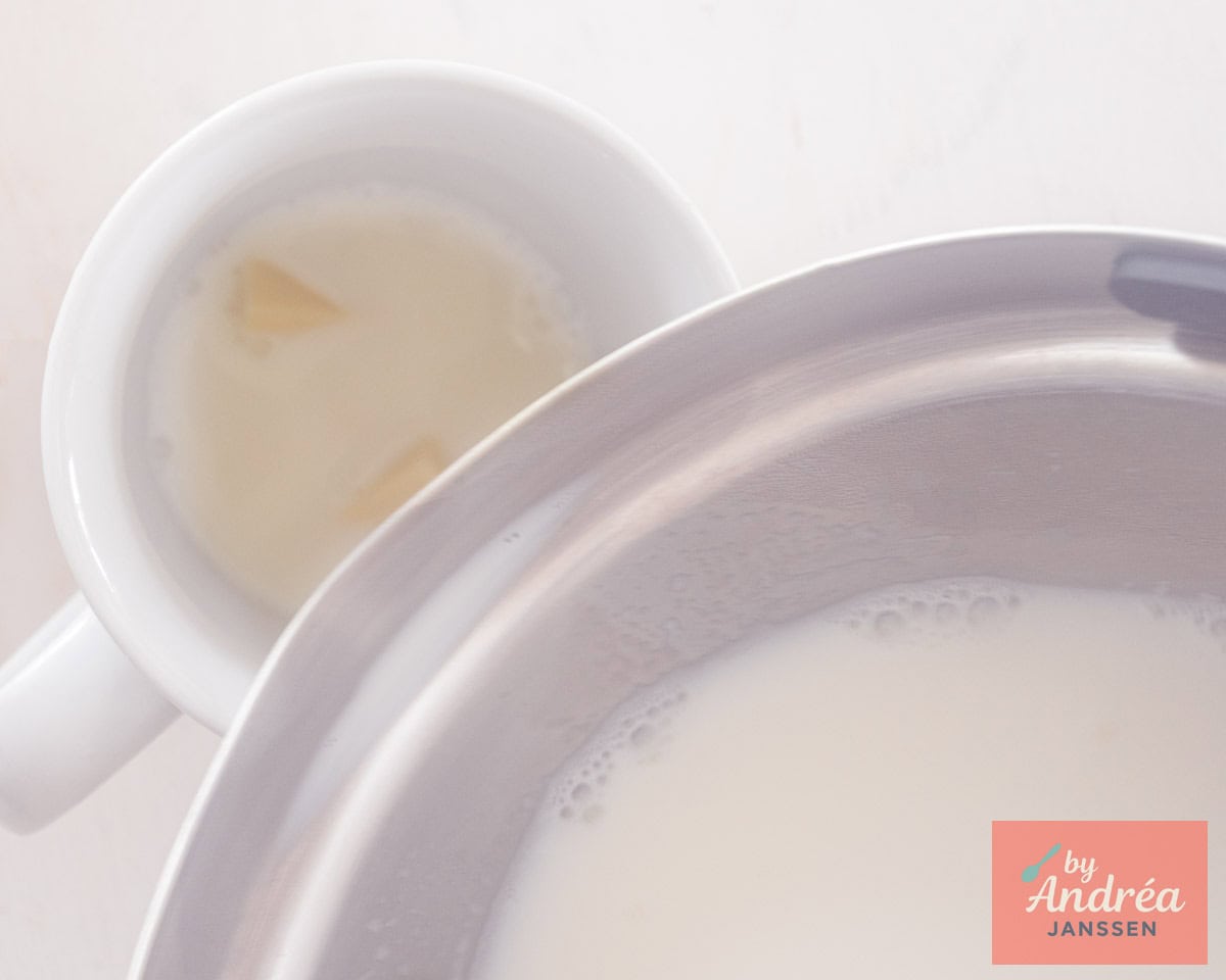 Hot milk is poured on chopped white chocolate