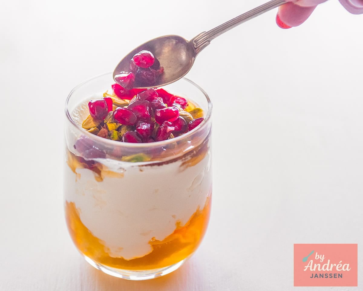 Top the glasses with strained yogurt and honey with pistachios and pomegranate seeds.