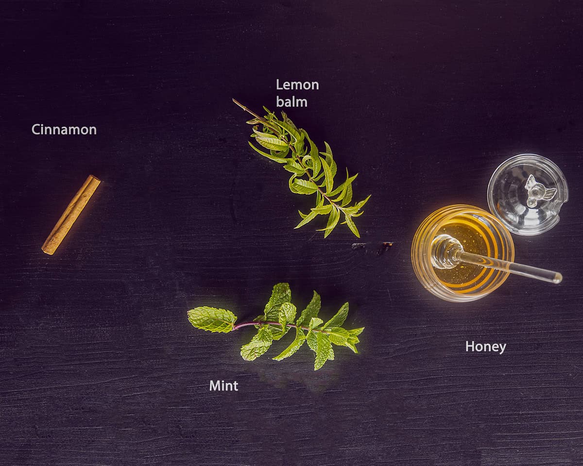 ingredients Mint Tea with Cinnamon on a dark background with text description