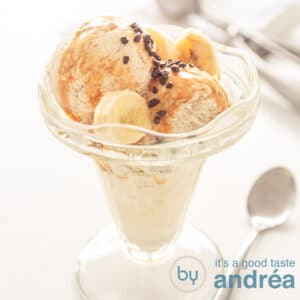 A square photo with a glass filled with banana chocolate ice cream and sauce