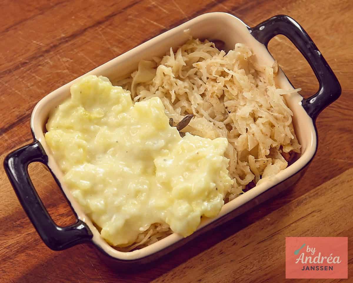 A casserole dish with ground beef, sauerkraut and mashed potatoes.