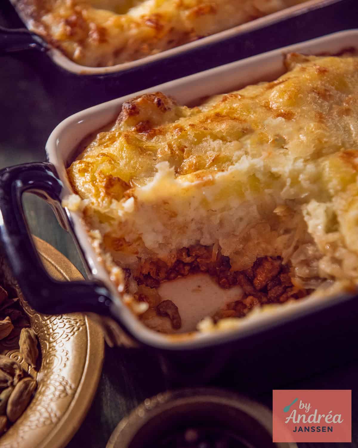 Curried Ground Beef Sauerkraut Casserole with a part of it removed so you can see the inside.