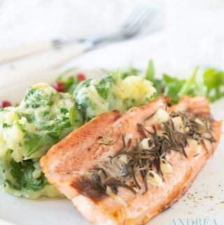 Arugula stew with grilled salmon on a plate