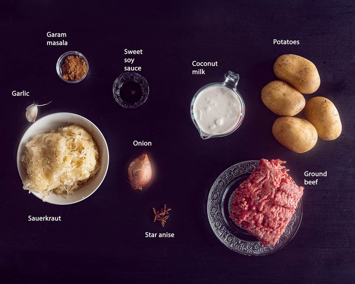 Ingredients Indian Sauerkraut Casserole on a black background with a text description