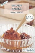 A glass bowl with a stuffed apple with raisins and walnuts in a caramel sauce. A text at the top: Dessert, Walnut Raisin Baked Apples, easy recipe.