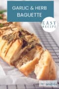 Part of a garlic baguette with herbs. A text at the top of an easy recipe, Garlic & Herb Baguette.
