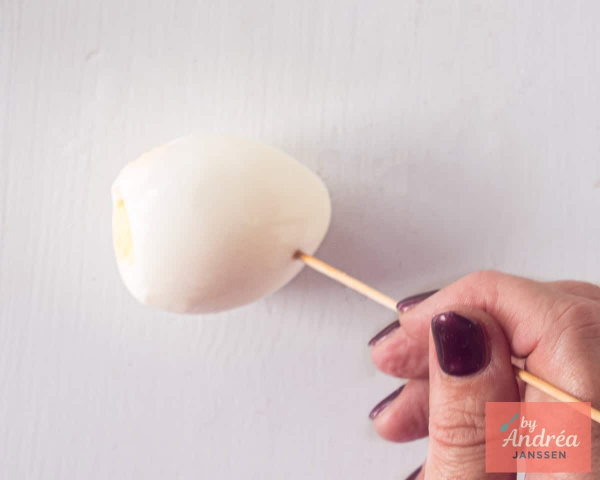 Prick some holes in a hard-boiled egg