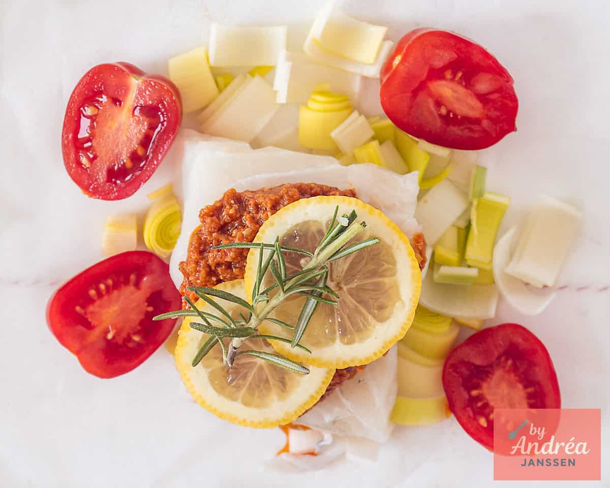 Top the fish with rosemary and lemon slices