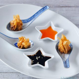 fried wonton with beef filling on spoons and two sauces
