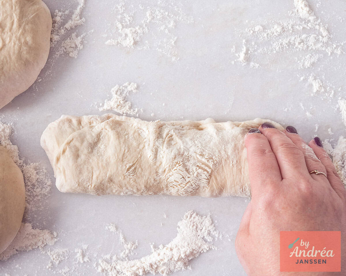 Divide the dough into three parts and shape the dough into baguettes.
