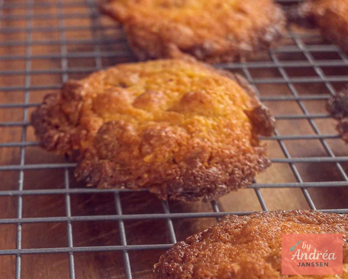 Baked cookies are cooling on a rack.