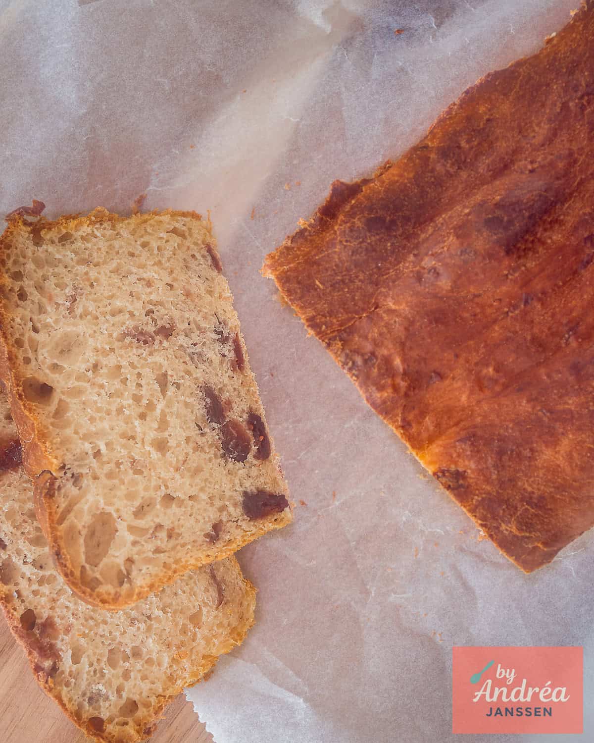 Picture from above of a cranberry loaf, two slices in front.