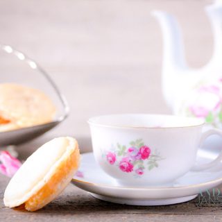 tea with Caramel macarons with salted caramel filling