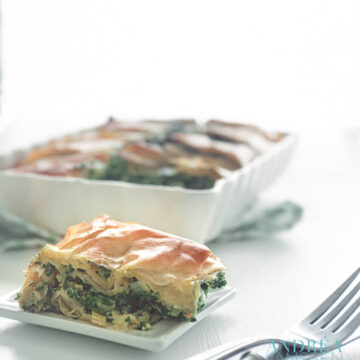 spanakopita in an oven casserole and on a plate