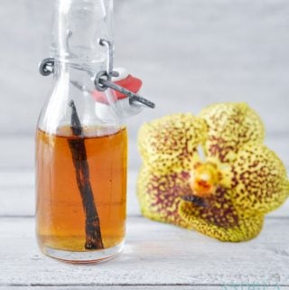 a bottle of Homemade vanilla extract and a vanille orchid