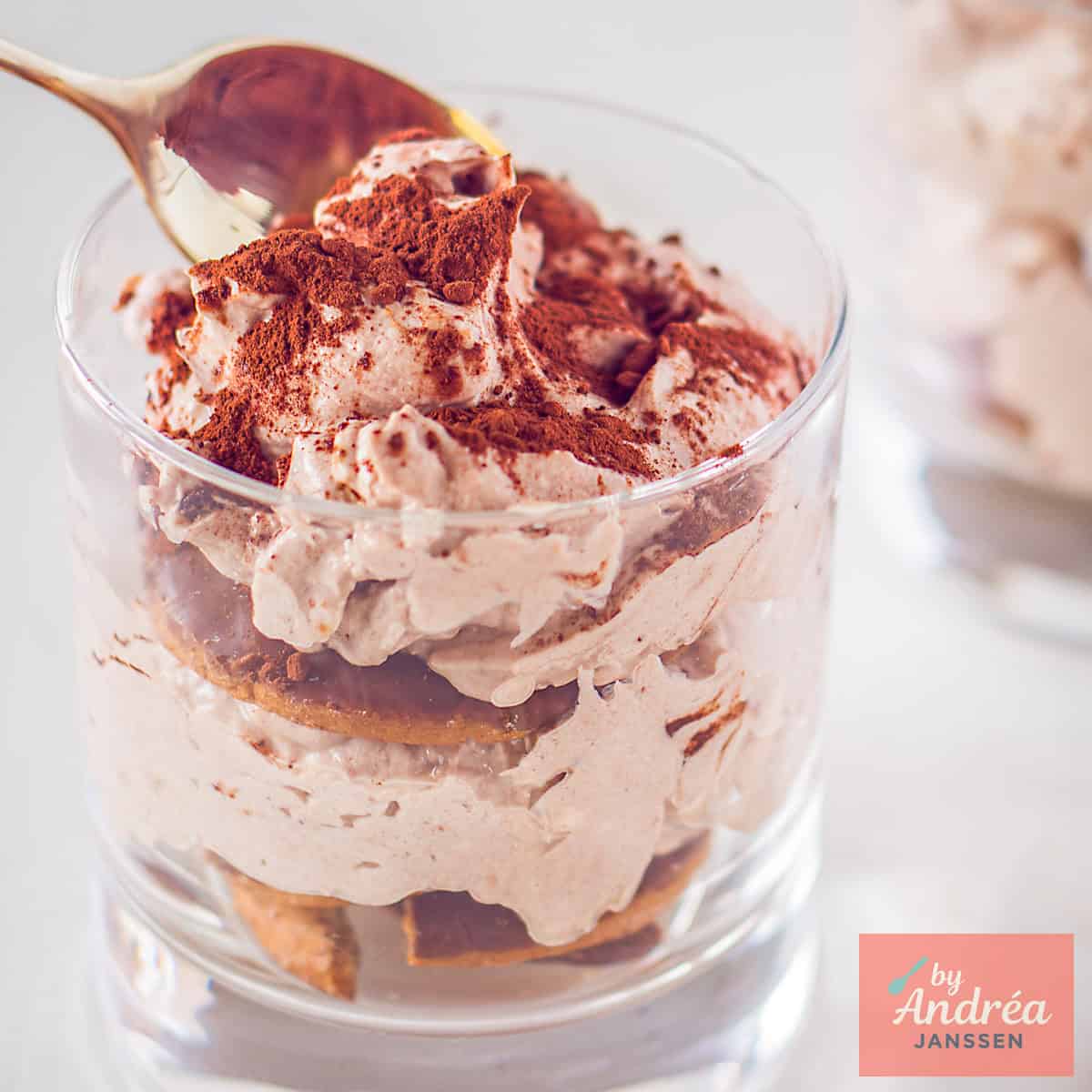 A square photo with chocolate tiramisu in a glass