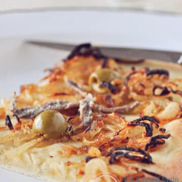 a piece of Pissaladière on a plate