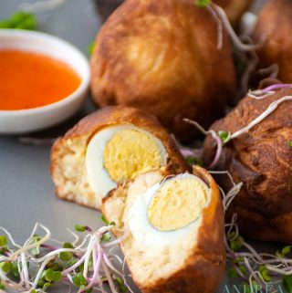 African Egg balls on a plate with sweet chili sauce