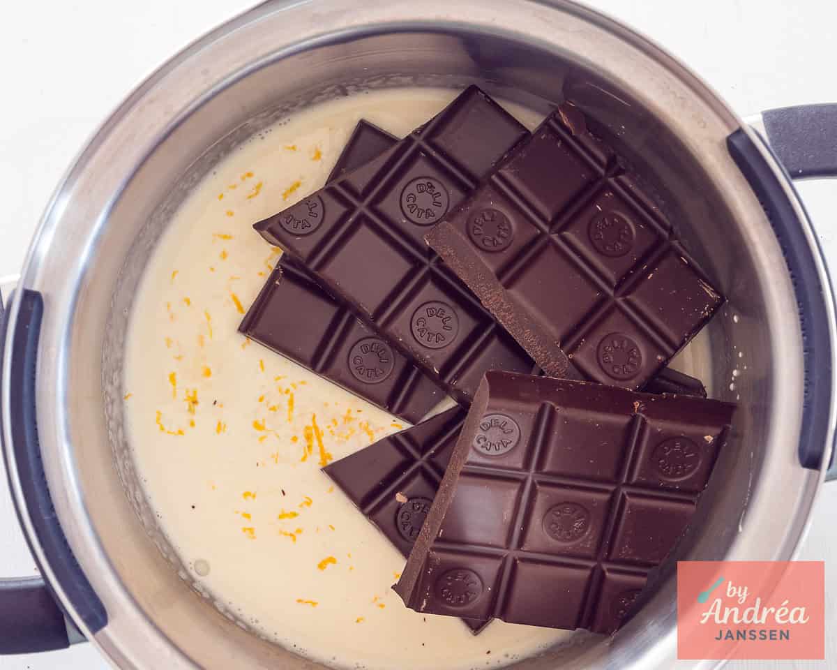 A small pan with cream, chocolate, and orange