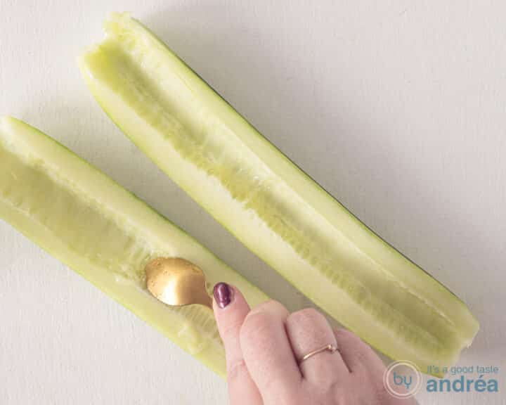 Scrape the seeds from the cucumber with a teaspoon.