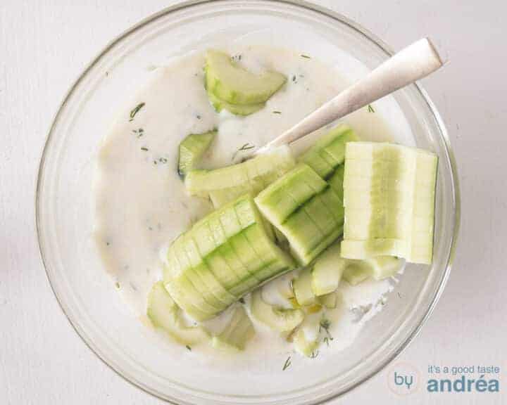 The cucumber segments are mixed into the sauce