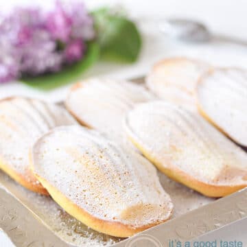6 orange madeleines on a plate