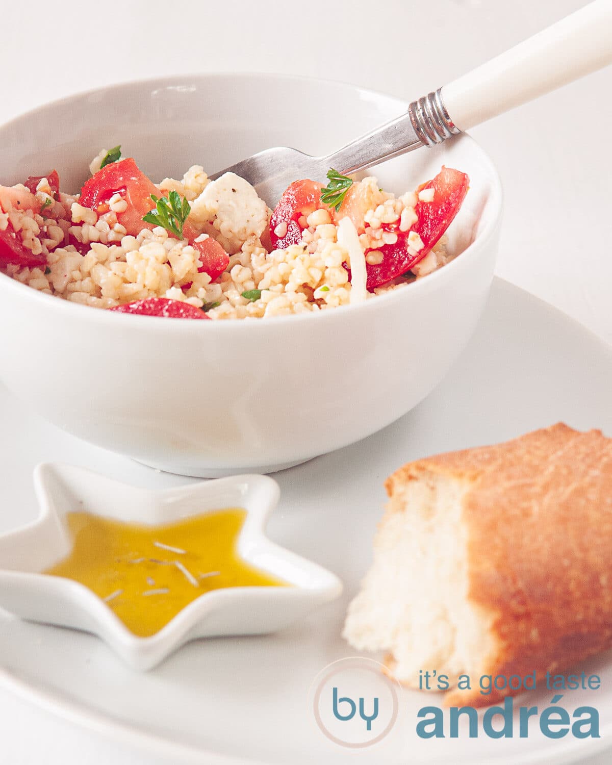 A bowl with bulgur salad, a baguette and herb oil