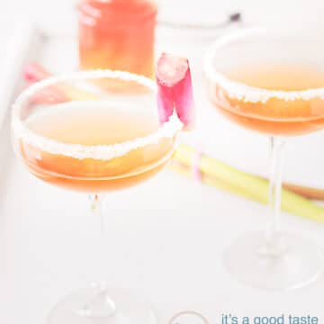 two glasses Rhubarb champagne cocktail with rhubarb syrup in the background