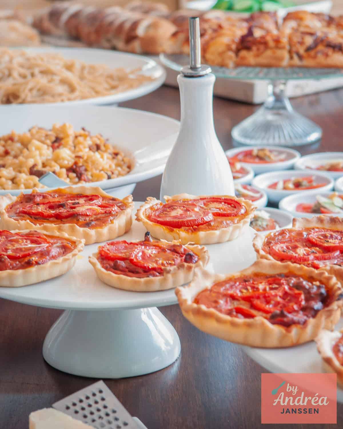 A photo with different recipes for an Italian buffet on a buffet table