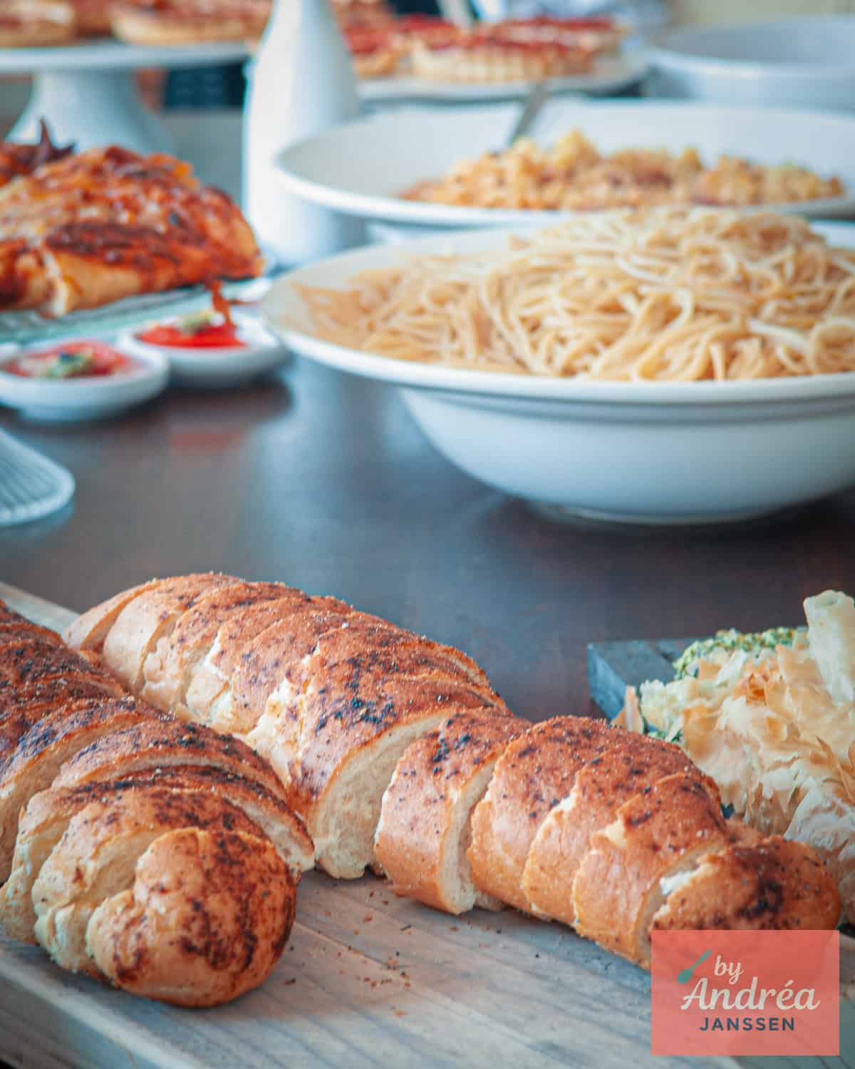 Various Italian dishes on a buffet table