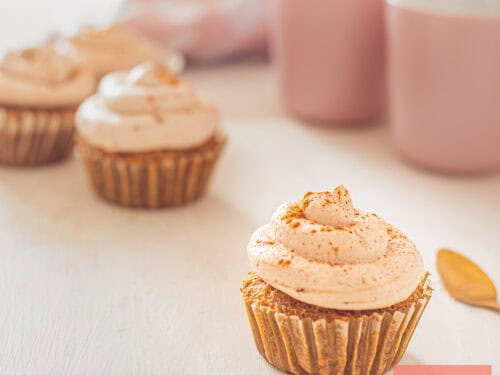 A square picture with four tiramisu cupcakes (one in front).