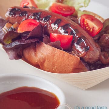 Bratwurst from the bbq on a bun with ketchup